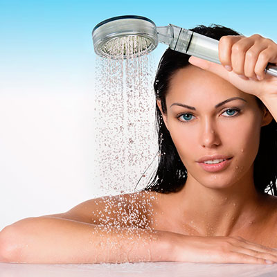 woman using the Diamond Shower