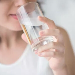 Woman drinking indalo alkaline water